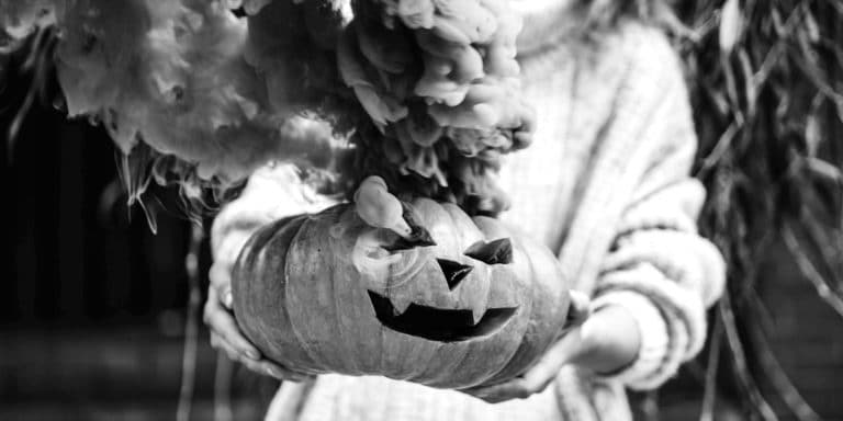 woman holding pumpkin 2x1