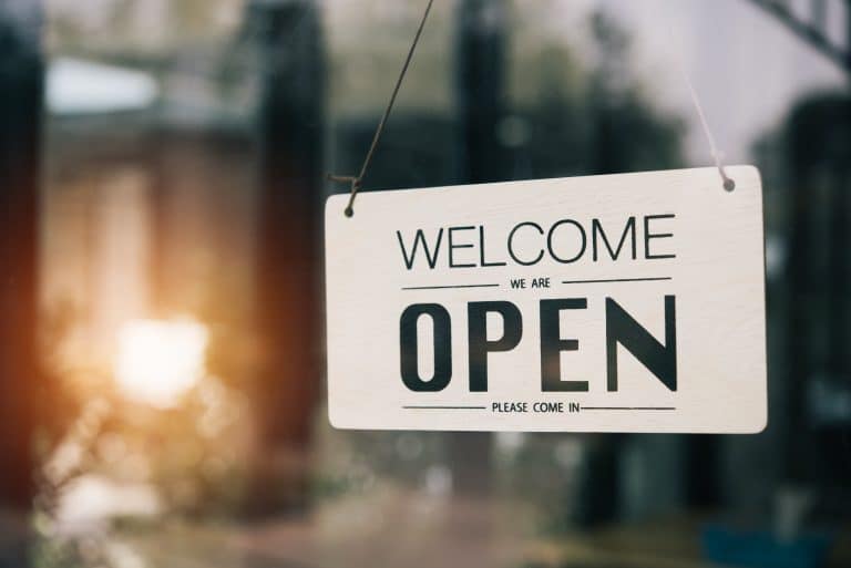 "Open" on cafe or restaurant hang on door at entrance