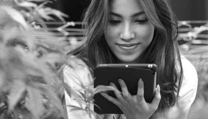 Cannabis Market Data - Woman on Device